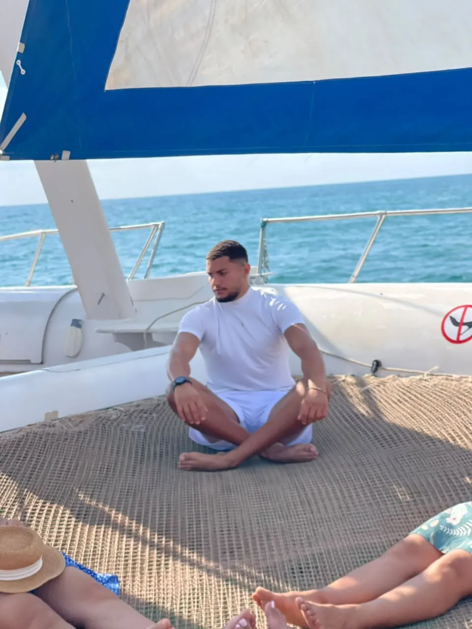 Morning yoga session on a Blue Lagoon catamaran in Djerba.